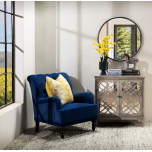 blue velvet upholstered armchair with button back detail