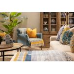 Upholstered armchair with wooden legs teal
