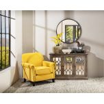 fully upholstered armchair in yellow velvet with stud detail