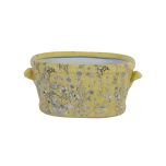 yellow ceramic footbath with daisy
