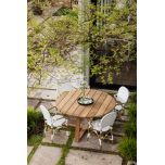 Round outdoor dining table in iroko
