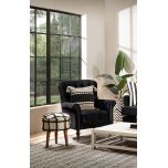 black and white knitted cushion with tassels