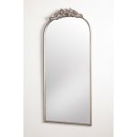 silver framed mirror with ornate top