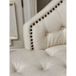 cream upholstered deco chair with deep buttoned detail, oak legs and castors, Château Collection 