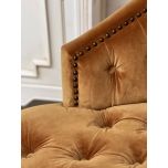 Deco chair upholstered in gold velour with deep buttoned detail, oak legs and castors Château Collection