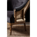 Deconstructed occasional chair with castors, upholstered in charcoal fabric