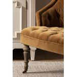 Deco chair upholstered in gold velour with deep buttoned detail, oak legs and castors Château Collection