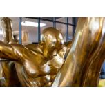 golden driver in mid air statue in mini plinth