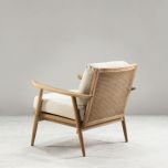 modern armchair with rattan back and linen seat and back cushion