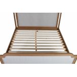 wooden 4 poster bed with fabric headboard and footboard