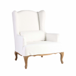 White wingback chair with brown wooden legs