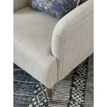 Upholstered armchair with wooden legs linen