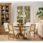 Round dining table in solid weathered oak