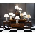 Glass cylinder base and gold trim lamp with cream lampshade