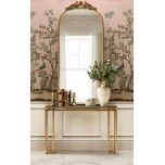 Gold framed mirror with ornate top