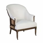 Deconstructed occasional chair with castors, upholstered in ivory fabric.