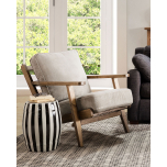 Wooden frame lounge chair with loose cushions upholstered in a grey fabric. 