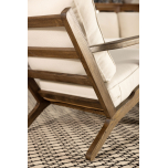 Wooden frame lounge chair with loose cushions upholstered in a ivory fabric.