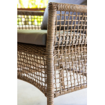 Outdoor cane armchair with grey cushions 