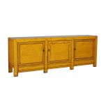 yellow lacquered sideboard with cupboards