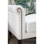 white tufted armchair in classic vanilla