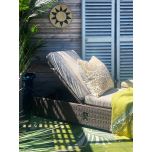 Outdoor lounger with cushion
