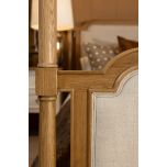 wooden 4 poster bed with fabric headboard and footboard