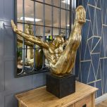 golden driver in mid air statue in mini plinth