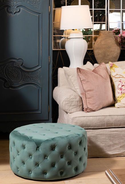 Round deep buttoned ottoman in velvet