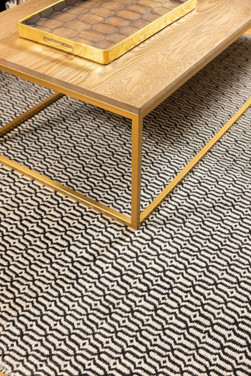 Block & Chisel stone coloured wool rug with black pattern detail