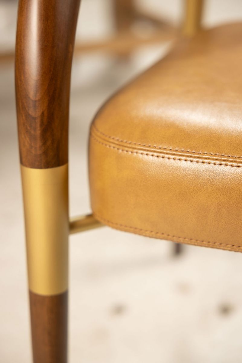 leather and wood tub chair with gold detail