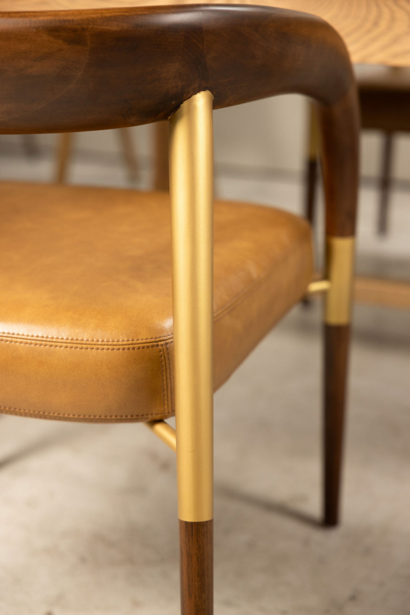 leather and wood tub chair with gold detail