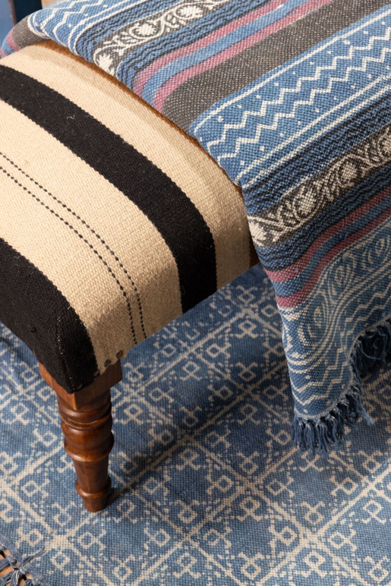 blue and red printed rug with fringe 