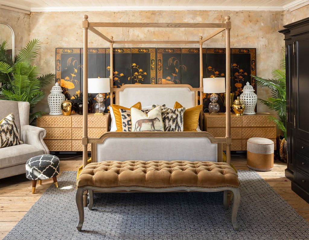 wooden 4 poster bed with fabric headboard and footboard