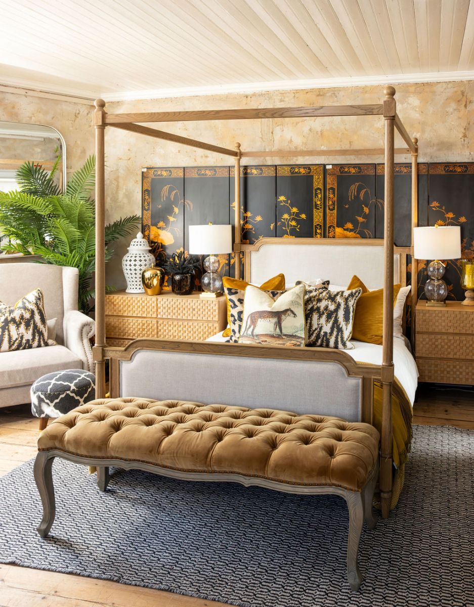 wooden 4 poster bed with fabric headboard and footboard