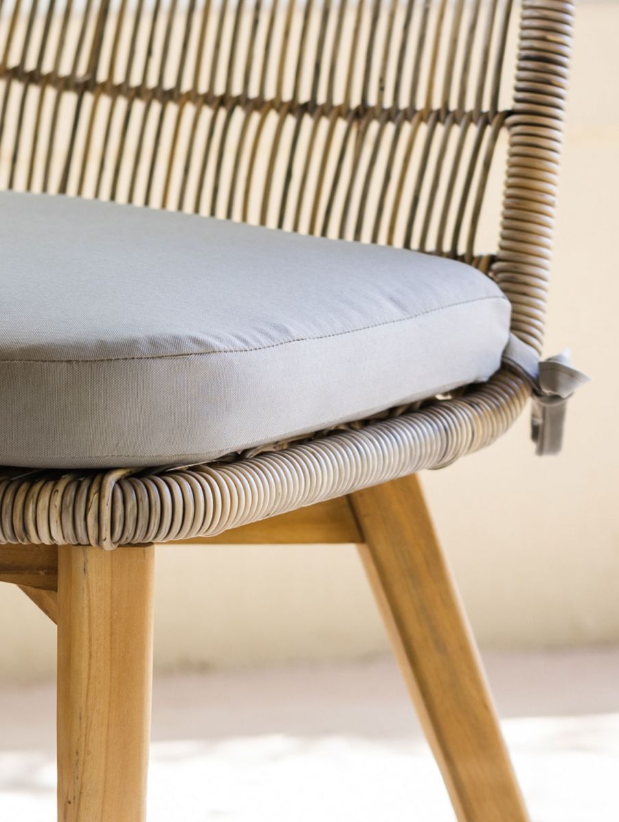 rattan and cane outdoor chair with grey cushion 