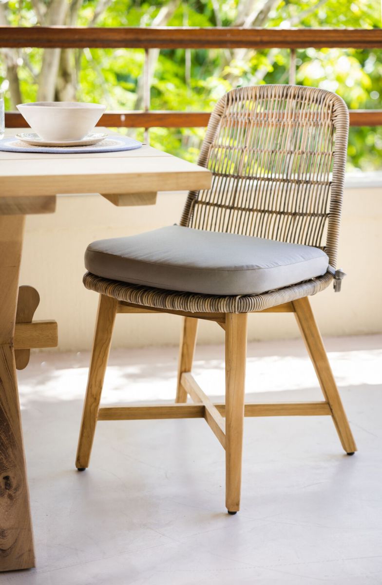 rattan and cane outdoor chair with grey cushion 