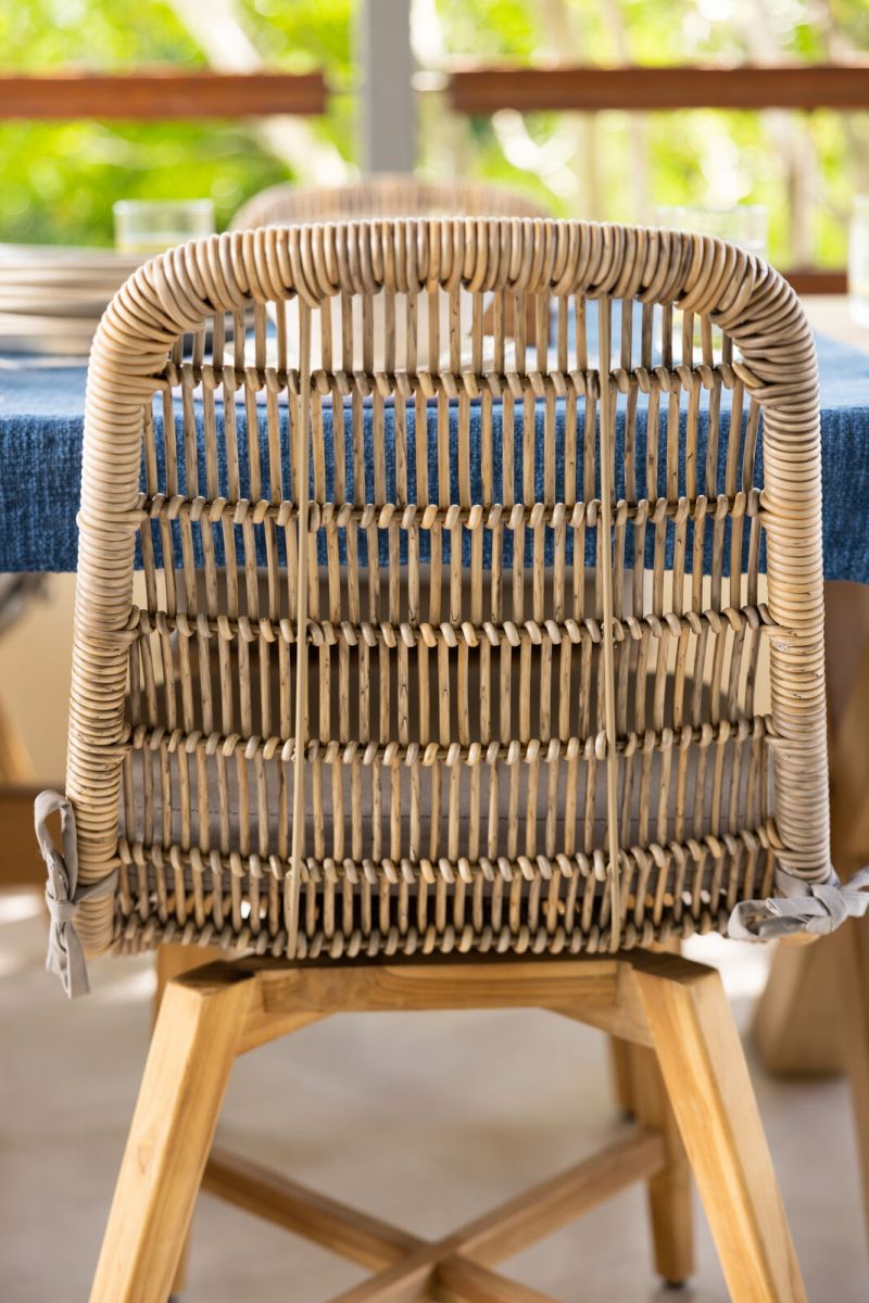 rattan and cane outdoor chair with grey cushion 