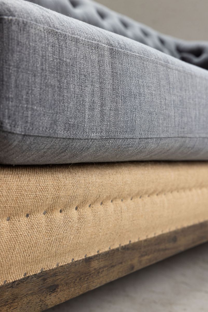 deconstructed chesterfield style sofa with wooden frame
