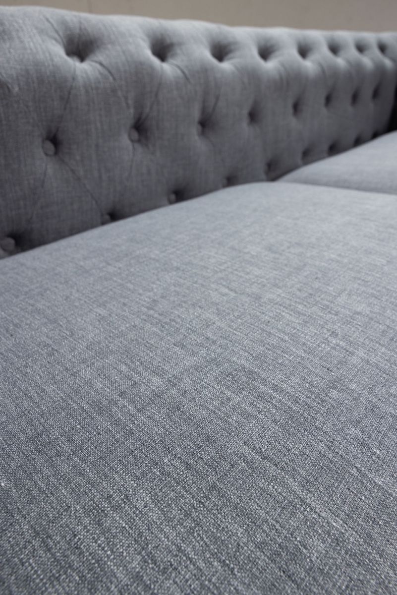 deconstructed chesterfield style sofa with wooden frame
