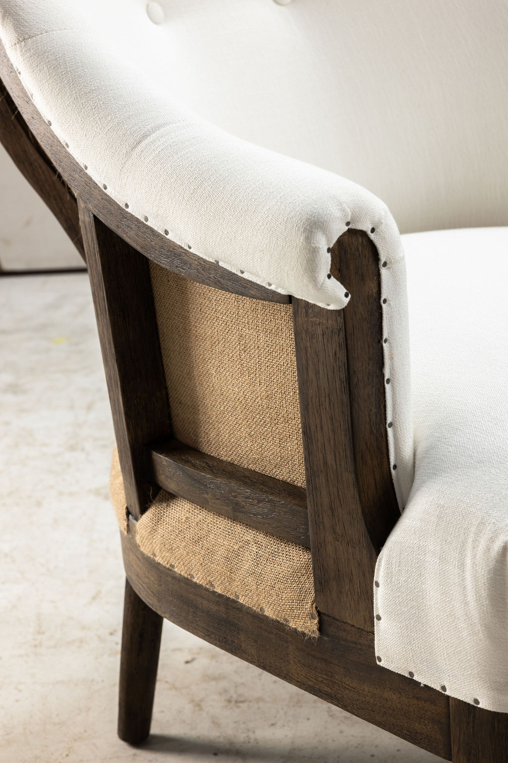 cream upholstered deconstructed chair on castors 