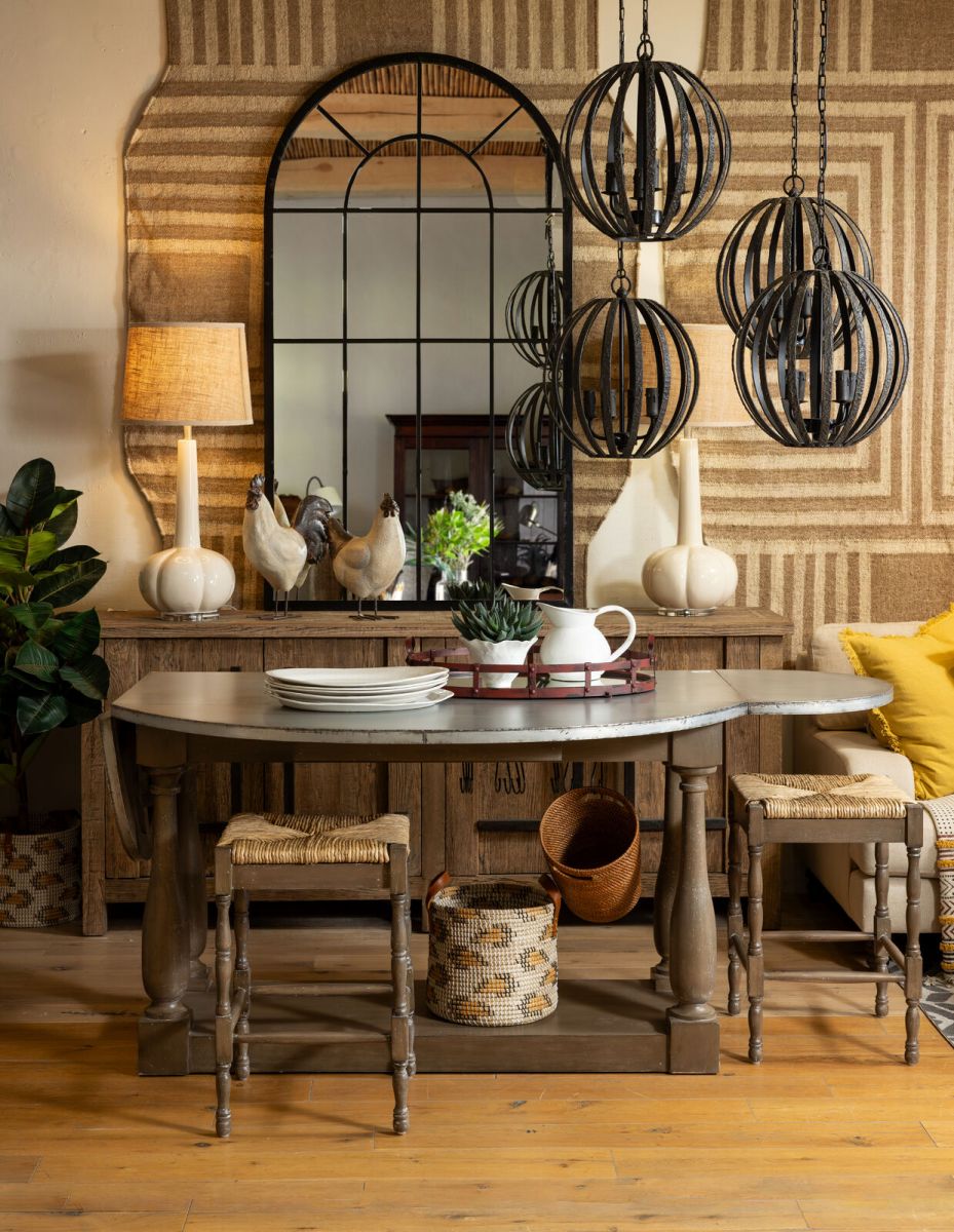 wooden kitchen island with 2 counter chairs