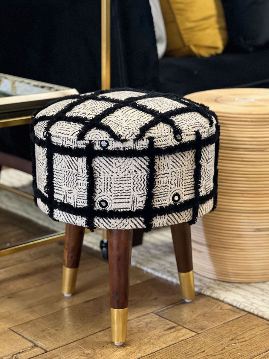 Black shaggy upholstered stool with wooden legs