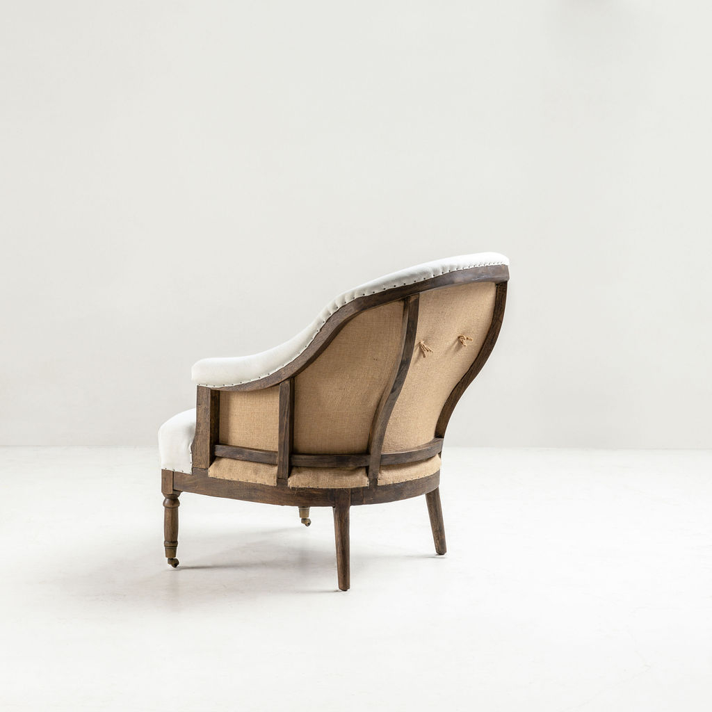 cream upholstered deconstructed chair on castors 