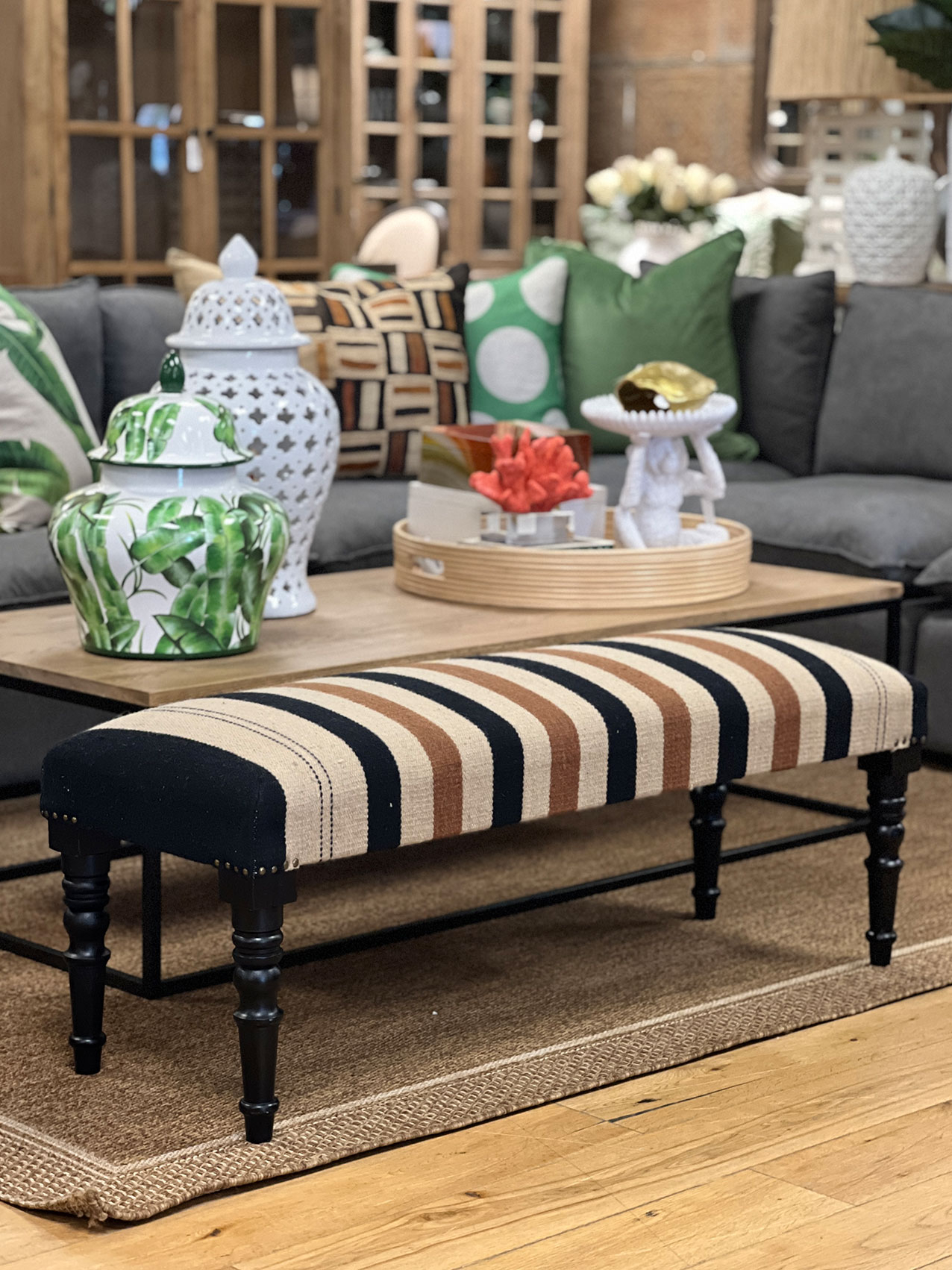 stripe upholstered ottoman with turned legs