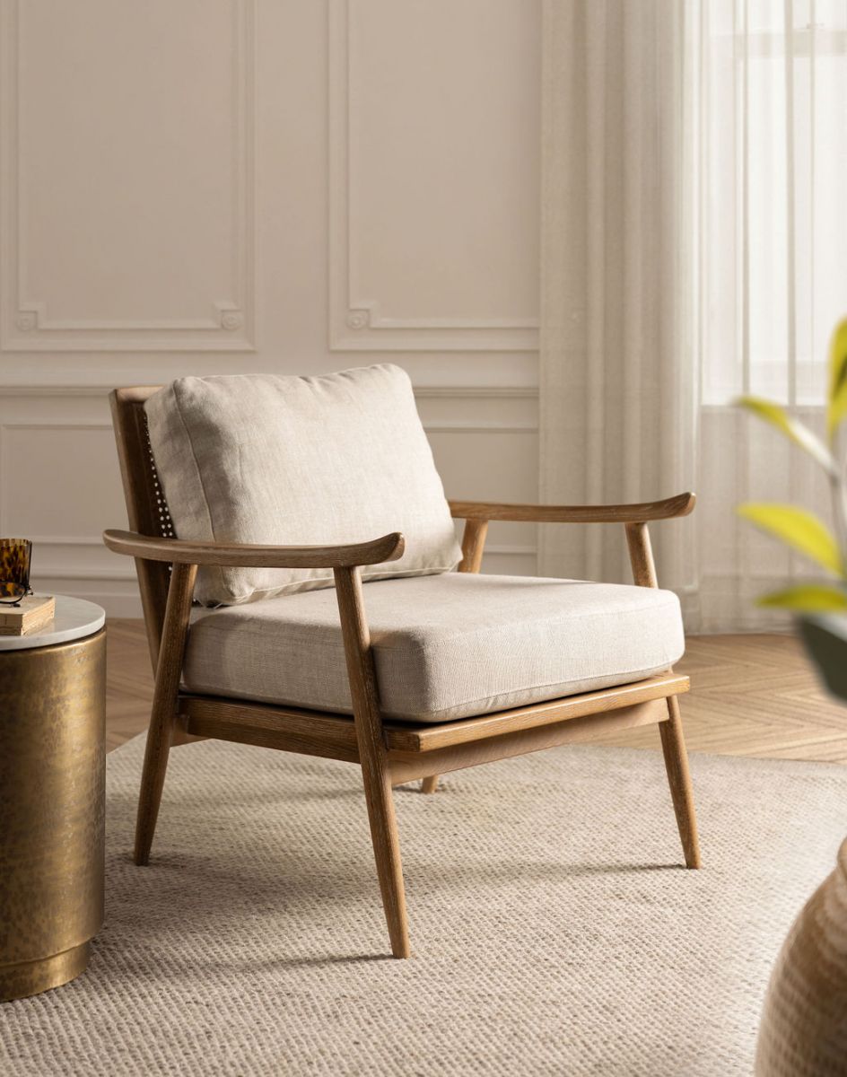 modern armchair with rattan back and linen seat and back cushion