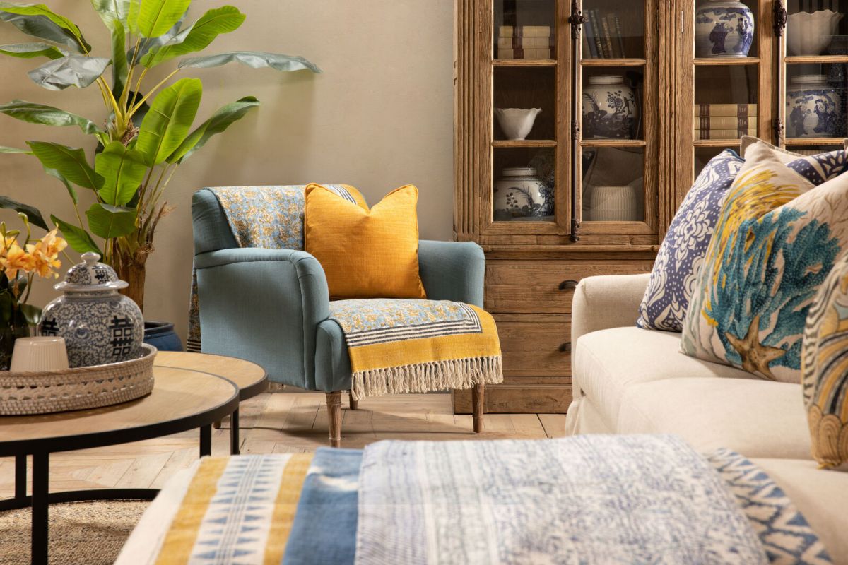 Upholstered armchair with wooden legs teal
