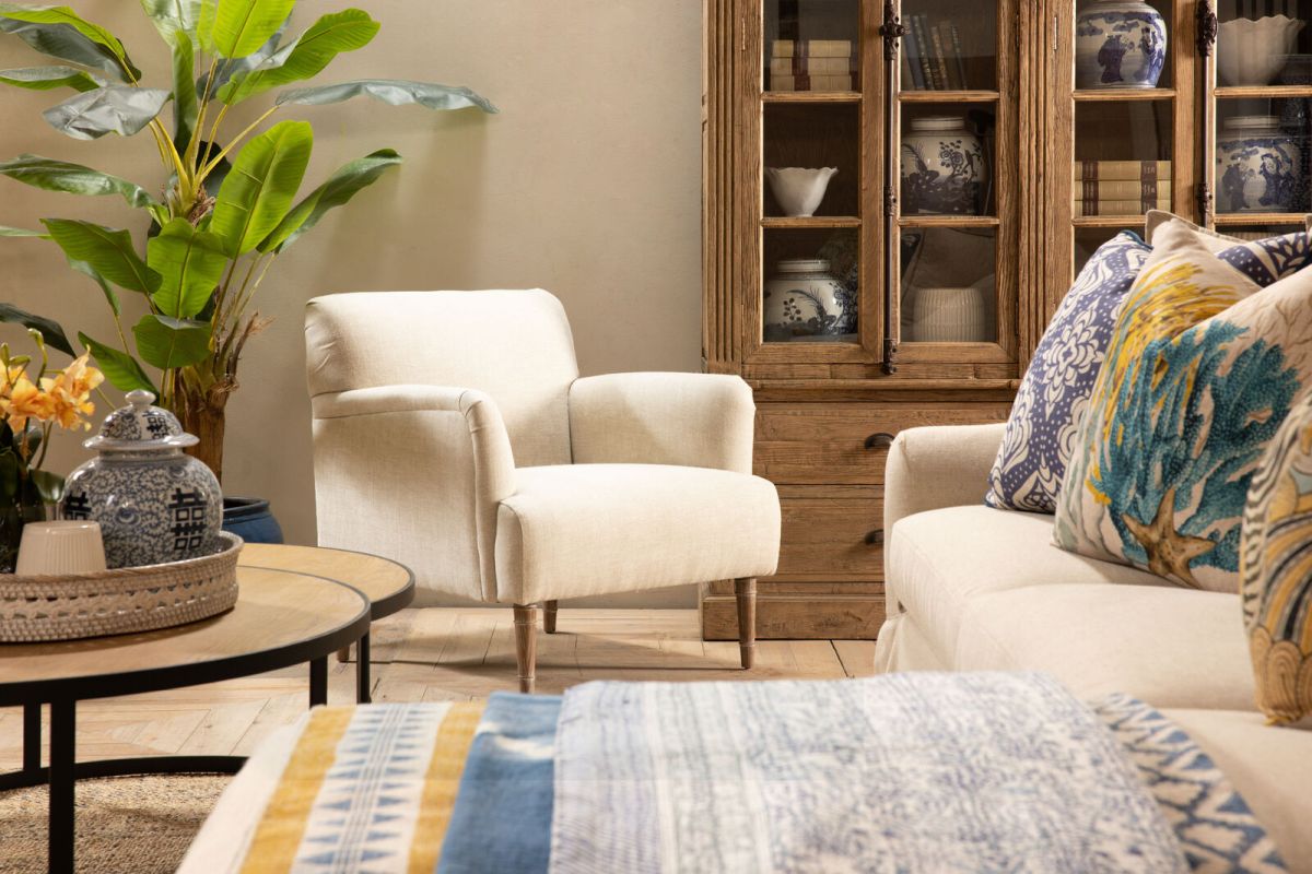 Upholstered armchair with wooden legs linen