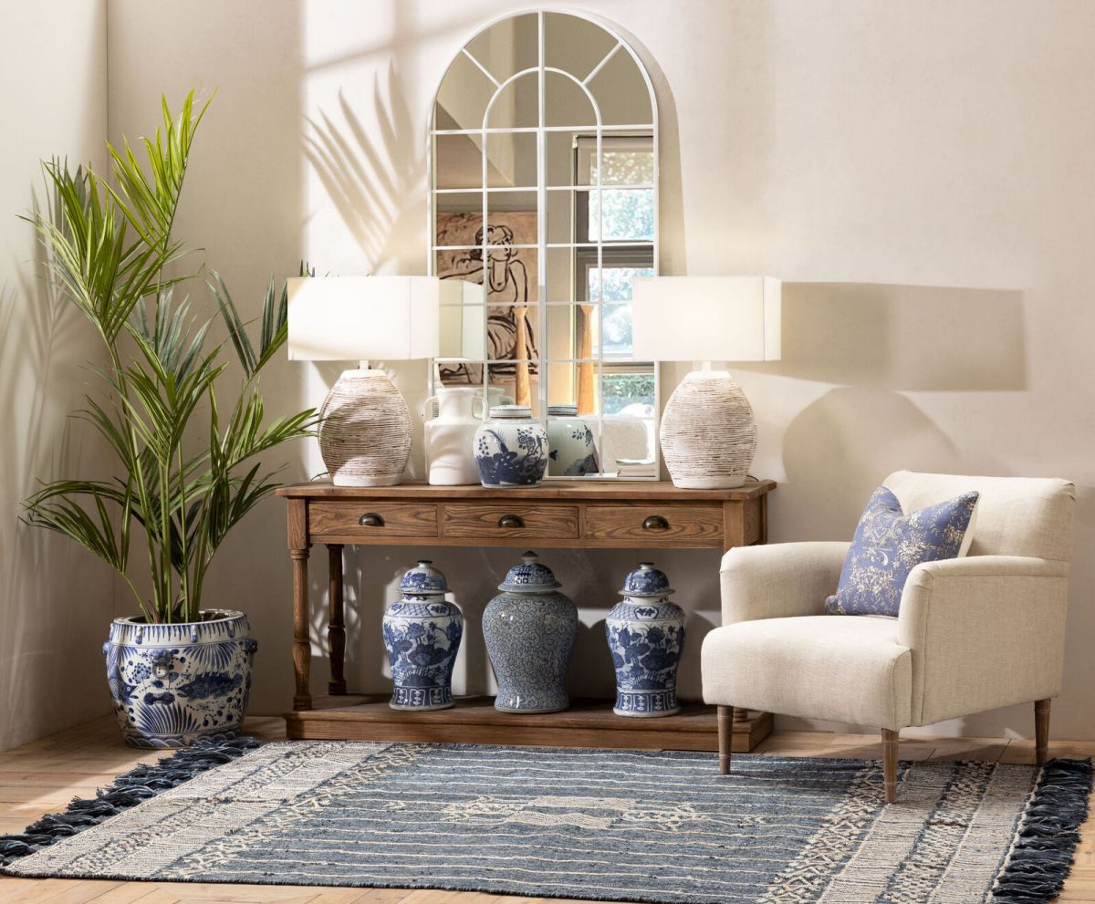 Upholstered armchair with wooden legs linen