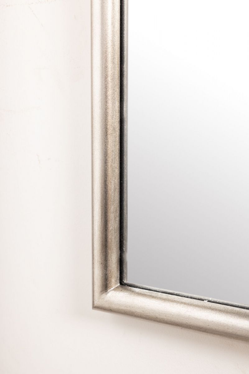 silver framed mirror with ornate top